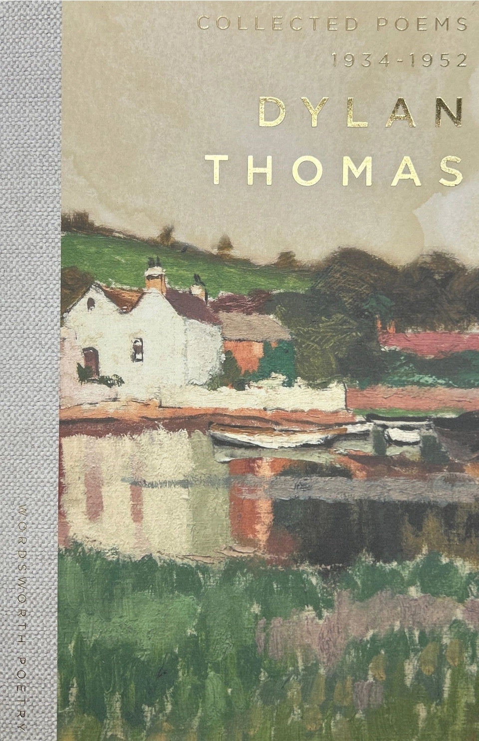 Painted book cover for Collected Poems 1934-1952 Dylan Thomas depicting an impressionistic river village scene with a distinctive white boathouse reflecting in the water, surrounded by green hills and highlighted by golden foil lettering