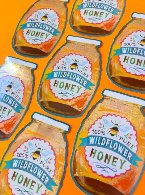 Digital illustration of multiple stylized jars of 100% Pure Wildflower Honey featuring golden contents, labels with blue-winged bumblebees on a blue ribbon, and an overall vibrant orange background