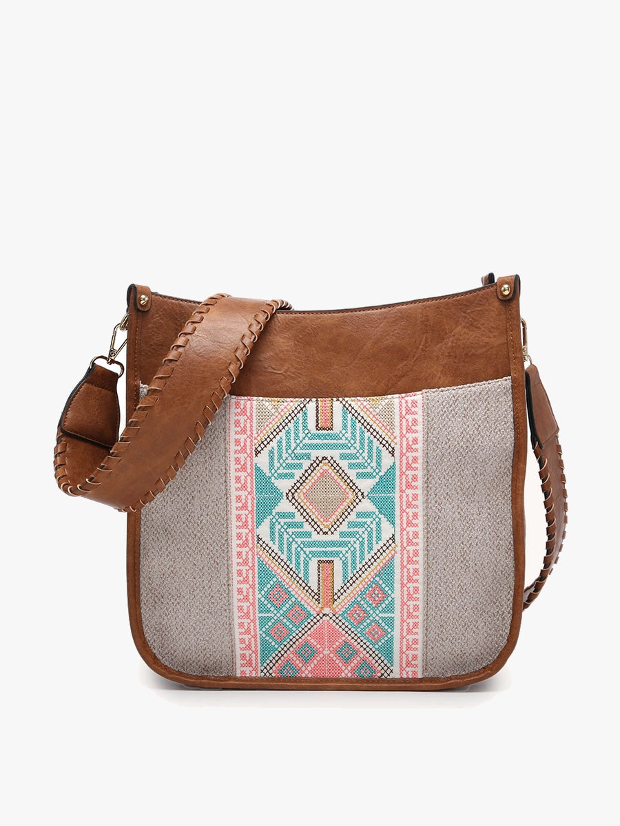 A tan brown faux leather shoulder bag with a grey woven textile front panel featuring a vibrant geometric embroidered pattern in pink, turquoise, and black, and a braided strap detail