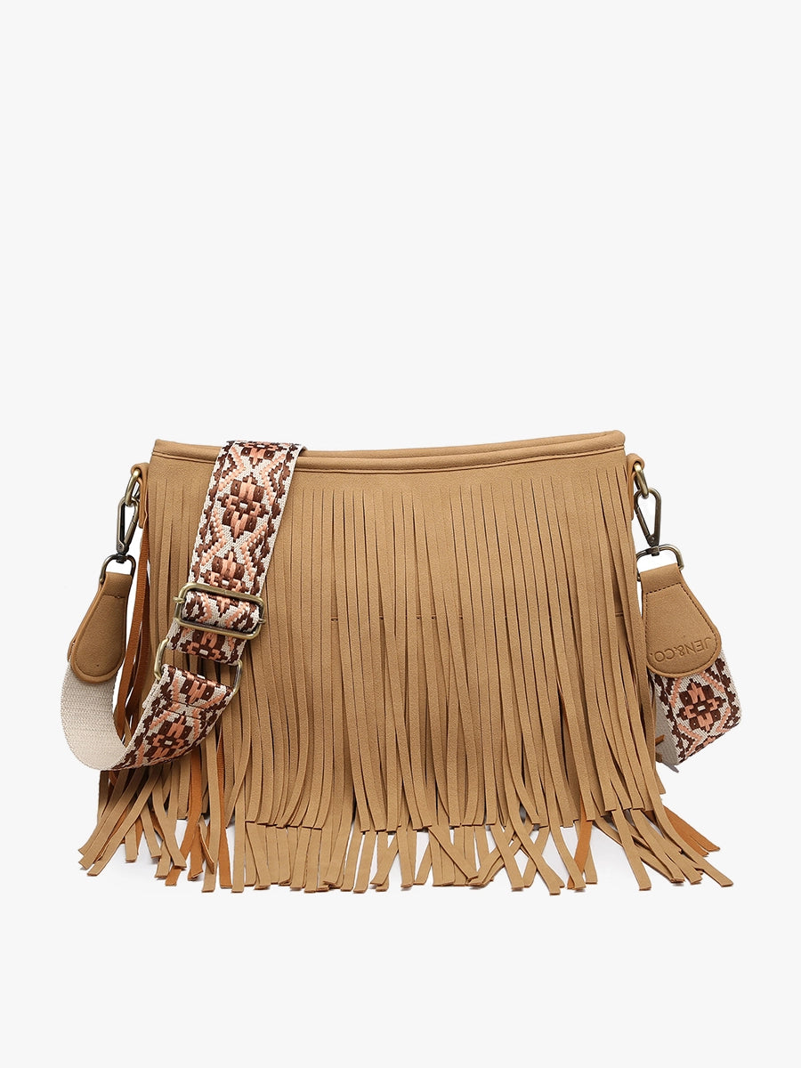 JEN & CO tan faux suede crossbody bag featuring long fringes and a wide adjustable strap with a multicolor geometric pattern against a white studio background